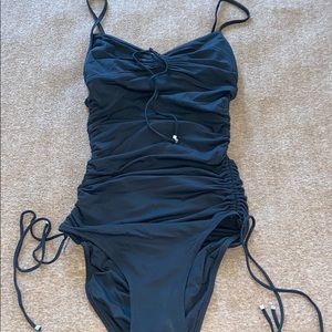 Women’s black one piece bathing ruched suit